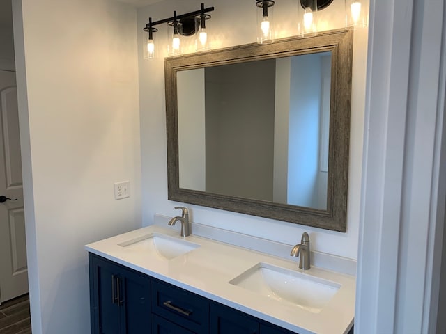 bathroom with hardwood / wood-style floors and vanity