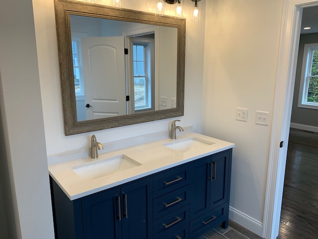 bathroom featuring vanity and wood-type flooring