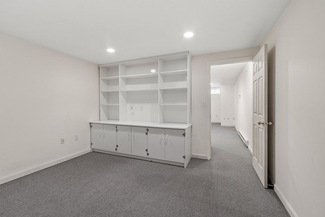 spare room featuring carpet floors, baseboards, and recessed lighting