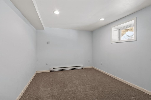 unfurnished room with a baseboard heating unit, recessed lighting, carpet floors, and baseboards