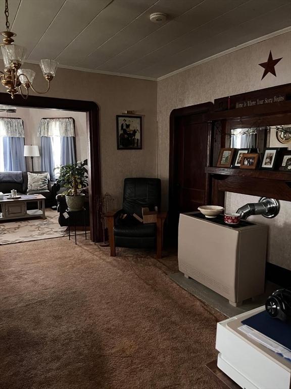 302 Cory St, Fall River, MA 02720 - carpeted living area featuring a chandelier and ornamental molding