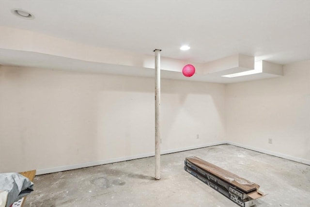 finished below grade area featuring baseboards and recessed lighting