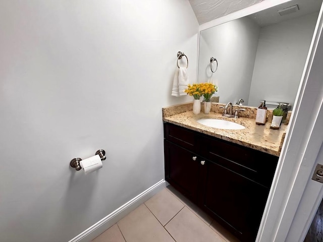 122 W 7th St Unit B, Boston, MA 02127 - bathroom with tile patterned floors, baseboards, and vanity