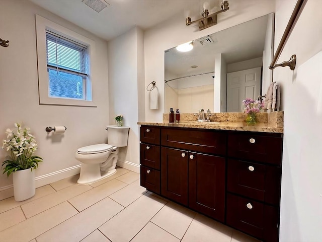 122 W 7th St Unit B, Boston, MA 02127 - bathroom featuring baseboards, toilet, tile patterned floors, and vanity