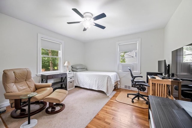 107 Washington St, Pembroke, MA 02359 - bedroom with multiple windows, a desk, light wood finished floors, and ceiling fan