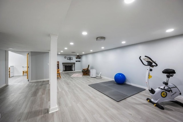 107 Washington St, Pembroke, MA 02359 - workout room with wood finished floors, a fireplace, and recessed lighting