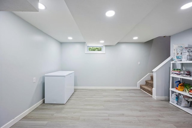 107 Washington St, Pembroke, MA 02359 - basement with refrigerator, recessed lighting, wood finished floors, and stairway