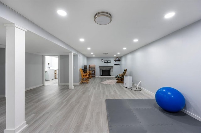 107 Washington St, Pembroke, MA 02359 - exercise room featuring recessed lighting, a fireplace, and light wood-style flooring
