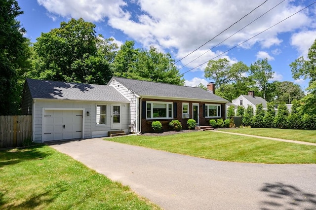 107 Washington St, Pembroke, MA 02359 - single story home with driveway, an attached garage, a chimney, and brick siding