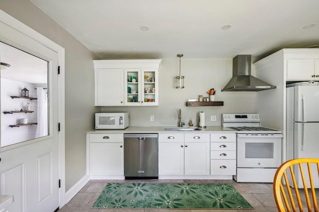 107 Washington St, Pembroke, MA 02359 - kitchen featuring wall chimney exhaust hood, white appliances, light countertops, white cabinets, and hanging light fixtures