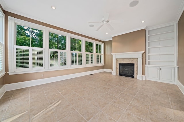 unfurnished living room with a wealth of natural light, light tile patterned flooring, built in features, and a fireplace