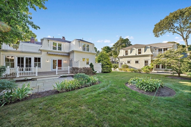 rear view of house with a lawn