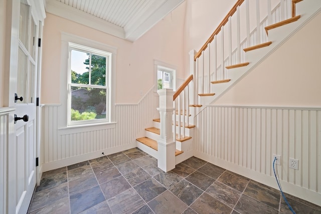 foyer entrance featuring crown molding