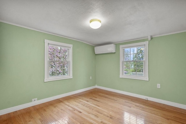 3 Norman Ave, Newburyport, MA 01950 - unfurnished room with a wall mounted AC, hardwood / wood-style flooring, ornamental molding, plenty of natural light, and baseboards