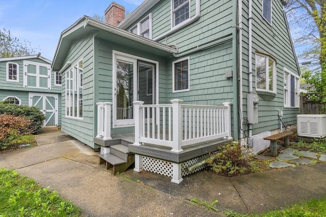 3 Norman Ave, Newburyport, MA 01950 - view of home's exterior with a chimney and a wooden deck
