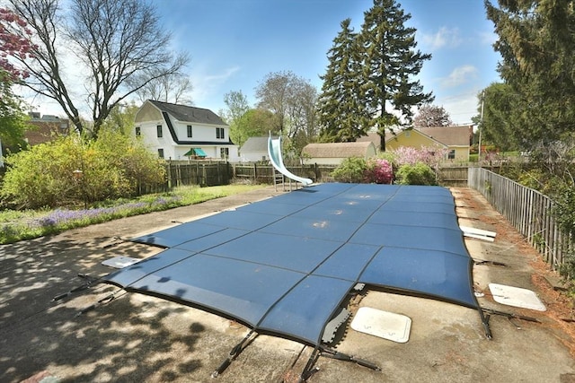 3 Norman Ave, Newburyport, MA 01950 - view of swimming pool with a water slide, a fenced backyard, and a patio area