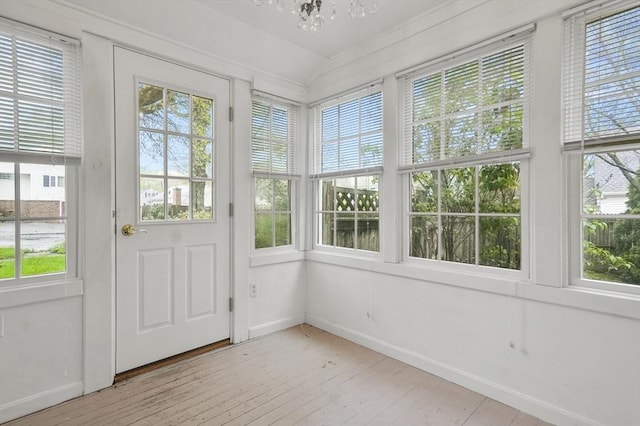 3 Norman Ave, Newburyport, MA 01950 - unfurnished sunroom with hardwood / wood-style floors, healthy amount of natural light, a chandelier, baseboards, and vaulted ceiling