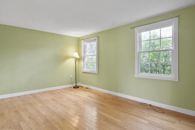 3 Norman Ave, Newburyport, MA 01950 - empty room with light wood-style flooring and baseboards