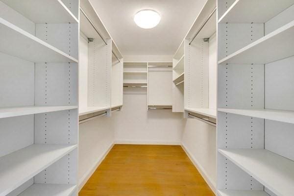 spacious closet featuring hardwood / wood-style floors