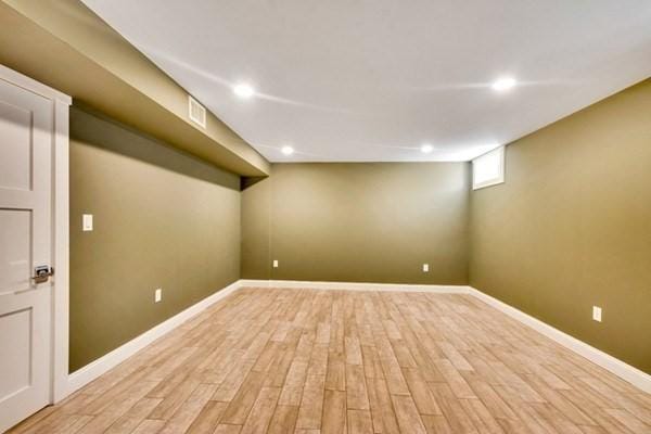 basement featuring light hardwood / wood-style flooring