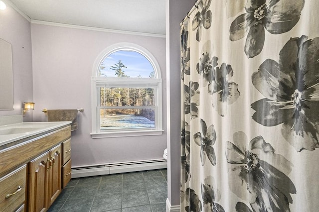 bathroom with vanity, toilet, crown molding, and baseboard heating