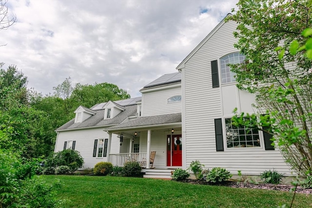 9 Buffalo Run, Southborough, MA 01772 - view of front facade with a porch, a front lawn, and solar panels