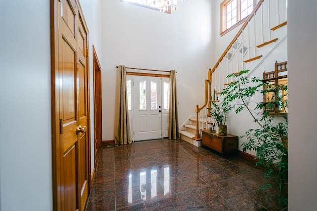 9 Buffalo Run, Southborough, MA 01772 - foyer featuring plenty of natural light, a towering ceiling, granite floors, stairs, and baseboards