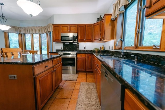 9 Buffalo Run, Southborough, MA 01772 - kitchen featuring stainless steel appliances, a sink, brown cabinets, and hanging light fixtures