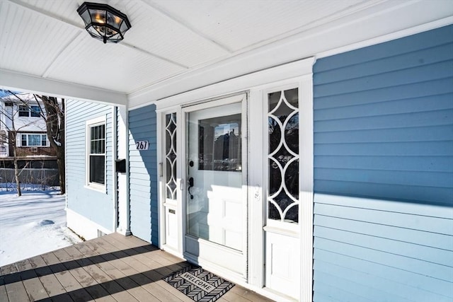 entrance to property featuring a porch