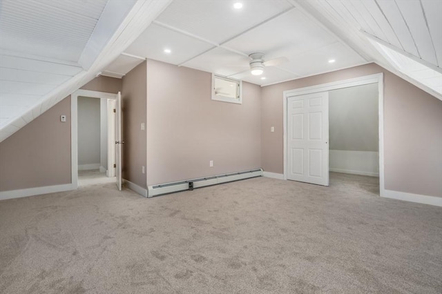 additional living space featuring ceiling fan, baseboard heating, light carpet, and lofted ceiling