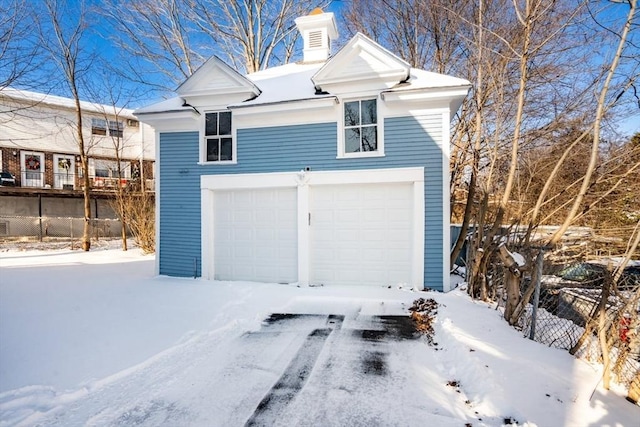 view of snow covered garage