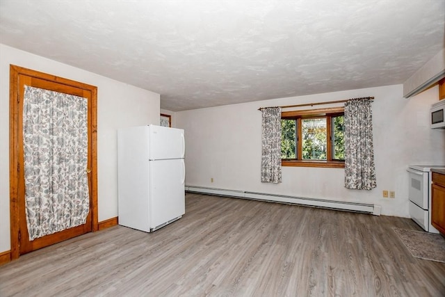 unfurnished living room featuring light wood finished floors, a textured ceiling, and a baseboard heating unit