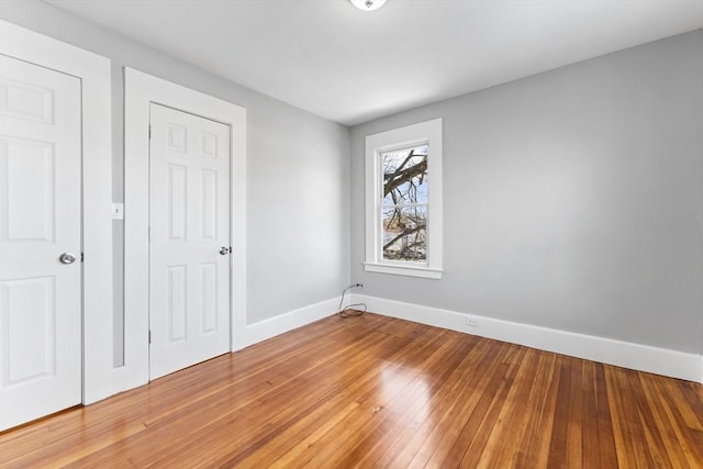 unfurnished bedroom with wood-type flooring