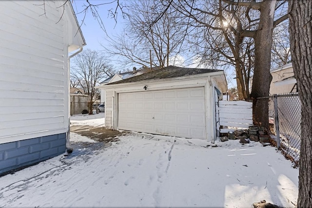 view of snow covered garage