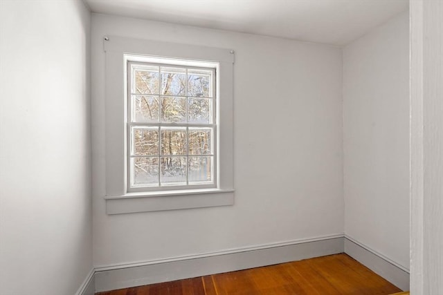 empty room with hardwood / wood-style floors