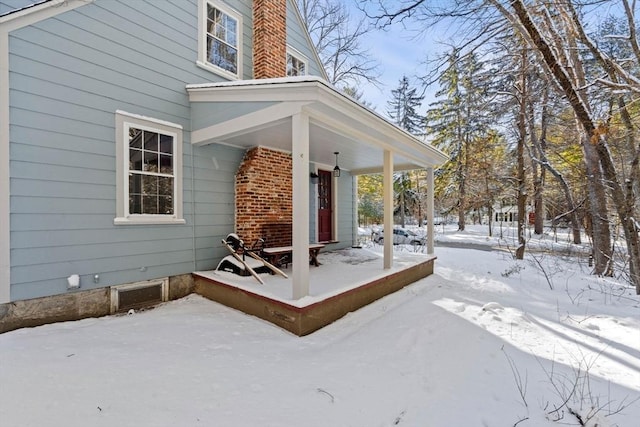 view of snow covered property