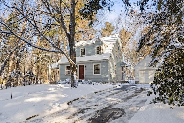 view of front of home with an outdoor structure and a garage