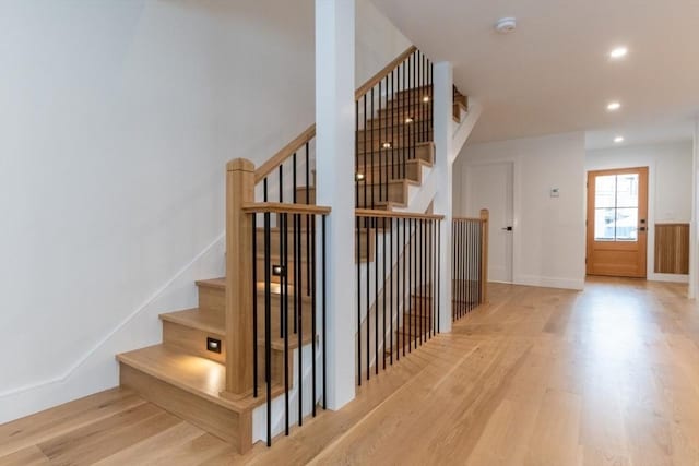 staircase featuring hardwood / wood-style floors