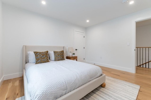 bedroom with hardwood / wood-style floors