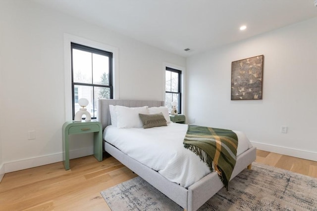 bedroom with wood-type flooring