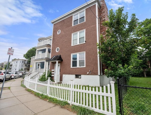 32 Saint Marks Rd Unit 1, Boston, MA 02124 - townhome / multi-family property with a fenced front yard