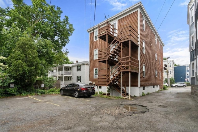 32 Saint Marks Rd Unit 1, Boston, MA 02124 - view of property with stairs and uncovered parking