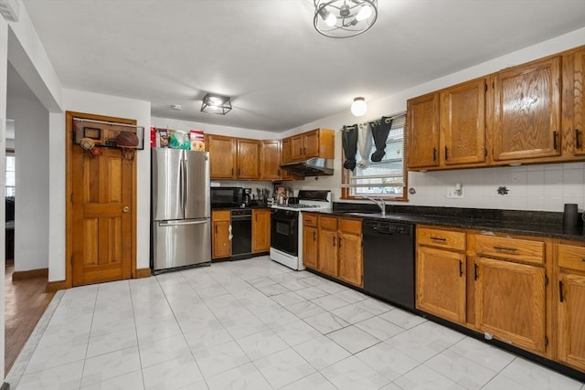 32 Saint Marks Rd Unit 1, Boston, MA 02124 - kitchen featuring black appliances, under cabinet range hood, and brown cabinets
