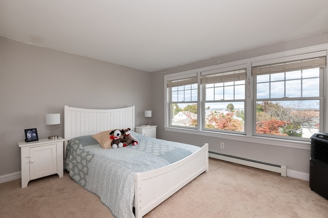 carpeted bedroom with a baseboard radiator