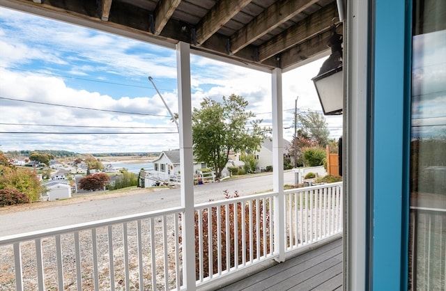 wooden deck with a water view