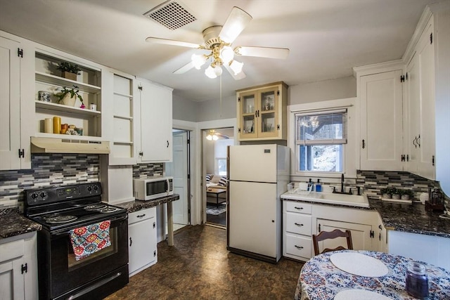 kitchen featuring white cabinets, white appliances, and tasteful backsplash