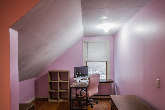 home office featuring wood-type flooring and vaulted ceiling