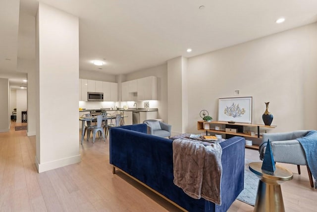 living room with light hardwood / wood-style flooring