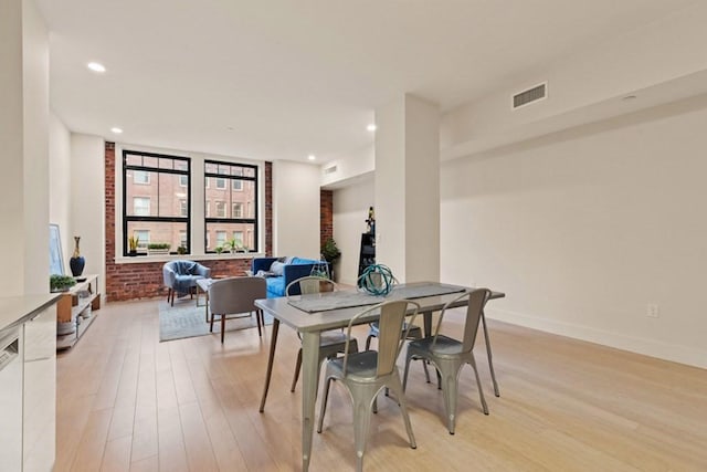 dining space featuring light hardwood / wood-style floors