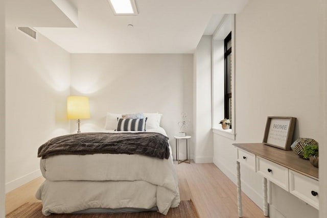 bedroom featuring light wood-type flooring